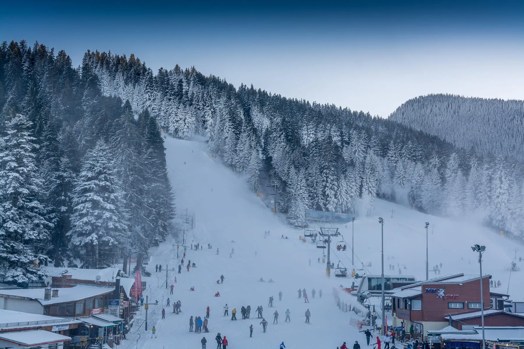 Snowy forests and a ski slope in Borovets (a general view of the area)